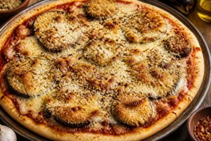 Recette de la pizza parmigiana : découvrez notre version gourmande !