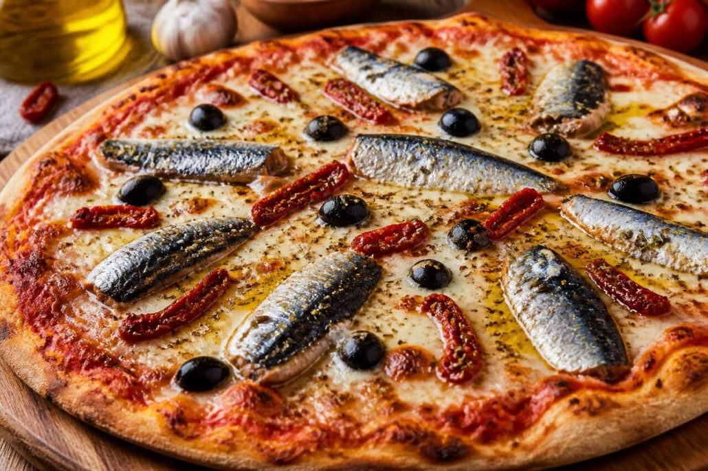 Pizza aux sardines, tomates et mozzarella : recette savoureuse